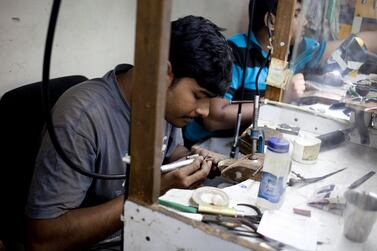 Dubai, United Arab Emirates - January 07 2013 - Shikant Das, a goldsmith, works on an engagement ring at the workshop of Nirali & Mickey Diamond and Jewellery at the Gold Souk in Deira. (Razan Alzayani / The National)  