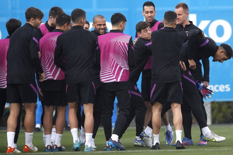 The Barcelona squad share a joke in training. EPA 