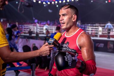 Ilyass Habibali of UAE, red, defeated Mustafa Al Tekreet of Iraq during the semi-finals match at the IFMA Muaythai World Championships at ADNEC in Abu Dhabi on Thursday, June 2, 2022. Victor Besa / The National