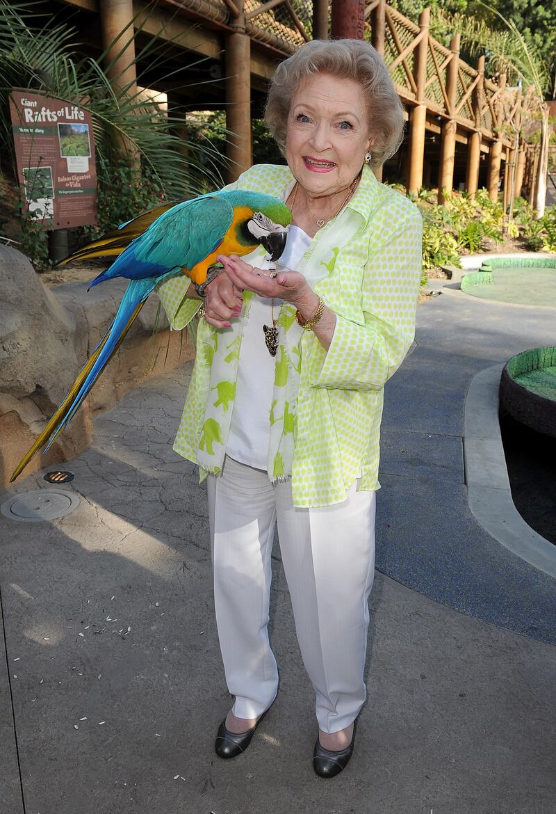 Betty White, in white trousers and a top with a lime green animal print jacket, visits the Greater Los Angeles Zoo Association's 44th Beastly Ball at the Los Angeles Zoo on June 14, 2014. AFP