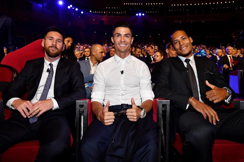 MONACO, MONACO - AUGUST 29: (L) Lionel Messi of FC Barcelona, Cristiano Ronaldo of Juventus and Virgil van Dijk of Liverpool pose for a photo during the UEFA Champions League Draw, part of the UEFA European Club Football Season Kick-Off 2019/2020 at Salle des Princes, Grimaldi Forum on August 29, 2019 in Monaco, Monaco. (Photo by Valerio Pennicino - UEFA/UEFA via Getty Images)