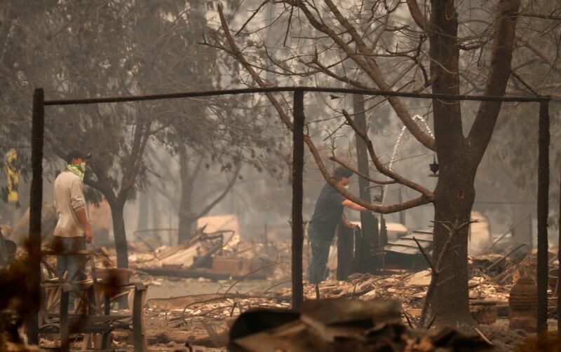 At least 10 people are dead in the wildfires. John G Mabanglo / EPA