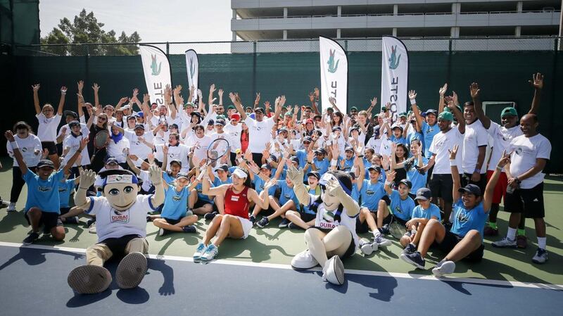 Latisha Chan with mascots Ace and Annette at the Lacoste Special Needs Clinic. Courtesy Dubai Duty Free Tennis Championships