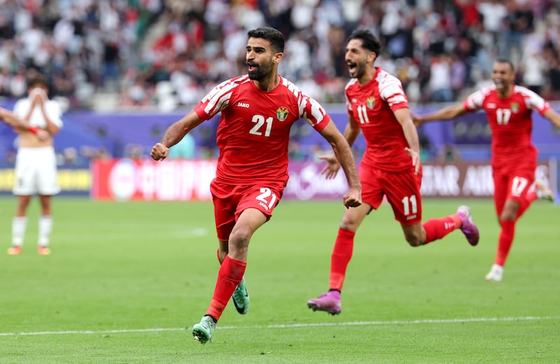 Nizar Al Rashdan of Jordan celebrates scoring his team's third goal. Getty Images