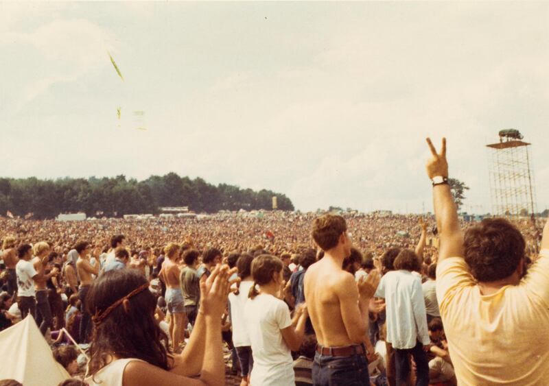 Revellers watch performing artists at the Woodstock Music Festival. Ted Berard / The Museum at Bethel Woods via Reuters