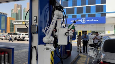 Robotic fueling arm at Adnoc petrol station in Al Reem Island, Abu Dhabi. Wajod Alkhamis / The National