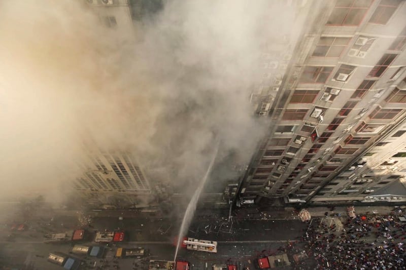 Firefighters work to control the fire. AP Photo