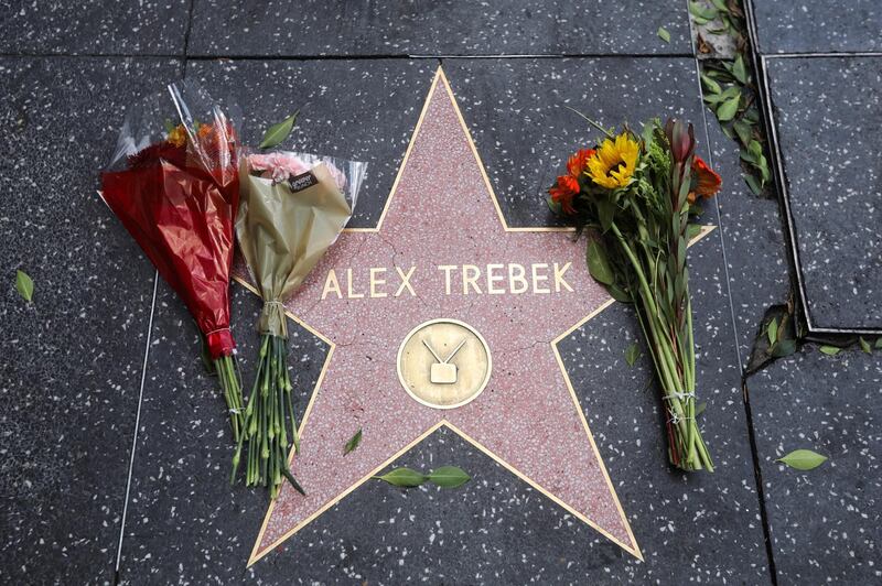 Flowers are placed on the Hollywood Walk of Fame star of TV host Alex Trebek in Los Angeles, California, on November 8, 2020. Reuters