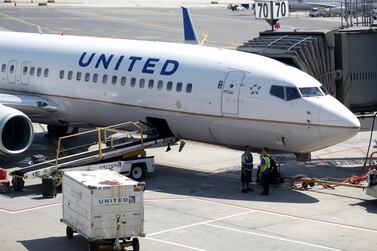 A United Airlines jet parked at Newark International Airport. The US carrier notified 36,000 employees last month that their positions are at risk, but has reduced the number of layoffs to 16,000 after many staff agreed to take voluntary redundancy. (AP Photo)