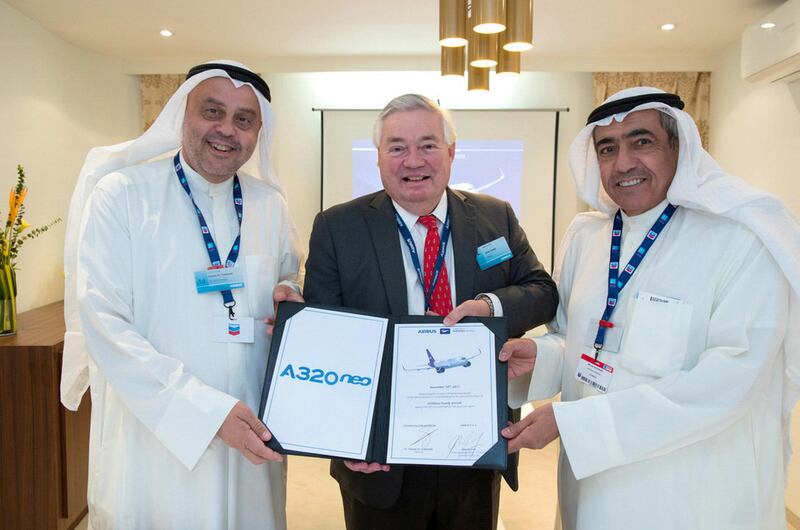 Hamad Al Tuwaijri, the chairman of Golden Falcon Aviation, and Airbus' John Leahy, alongside Ali Al Fouzan, the chairman of Wataniya Airways. Courtesy Airbus