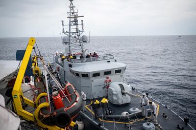 An Italian naval vessel floats next to the Sea Watch 3 German charity ship during migrant disembarkation off the coast of Lampedusa, Italy May 19, 2019. Picture taken May 19, 2019. Nick Jaussi/Sea-Watch/Handout via REUTERS ATTENTION EDITORS - THIS IMAGE WAS PROVIDED BY A THIRD PARTY. NO RESALES. NO ARCHIVES. MANDATORY CREDIT