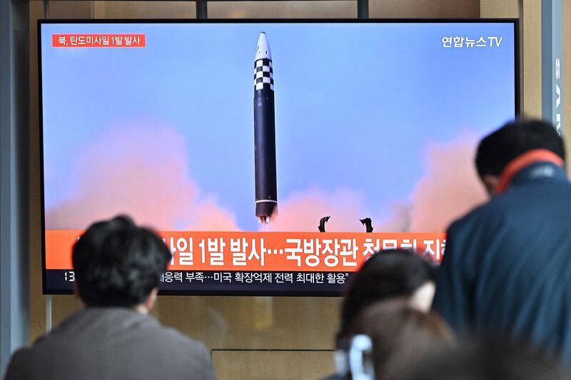 A news broadcast at a railway station in Seoul on May 4, 2022 with file footage of a North Korean missile test. AFP