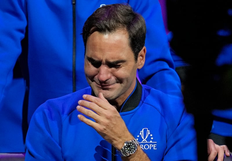 Roger Federer struggles to contain his tears after the Laver Cup match on Friday. Federer lost the doubles match with Nadal, marking the end of an illustrious career that included 20 Grand Slam titles. AP