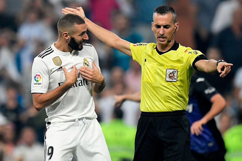 Real Madrid forward Karim Benzema reacts to referee Santiago Jaime Latre. AFP