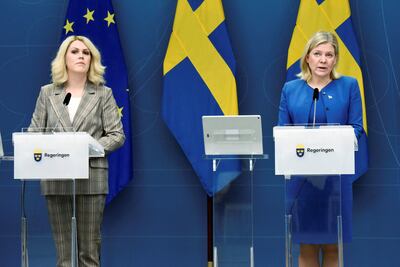 Sweden's Prime Minister Magdalena Andersson, right, and Minister of Social Affairs Lena Hallengren announce the end of restrictions. Reuters