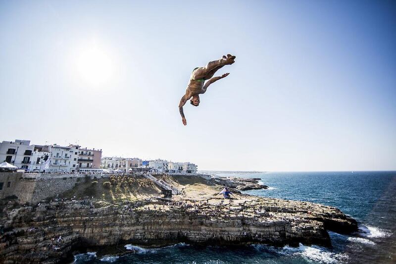 Alessandro De Rose of Italy dives from the 27-metre platform during the first training session for the fifth stop of the Red Bull Cliff Diving World Series in Polignano a Mare, Italy. Dean Treml / Red Bull via Getty Images