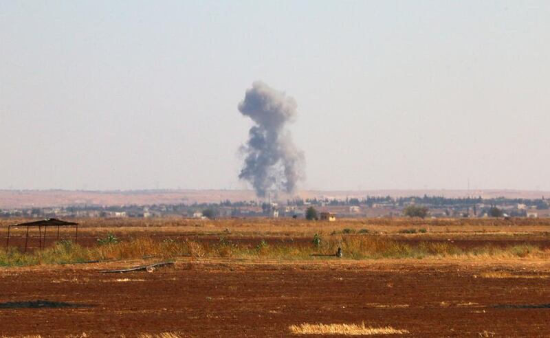 Smoke billowing on the outskirts of Marea, in Syria's northern Aleppo district, during clashes between opposition fighters and ISIL. Zakariya Al Kafi / AFP Photo