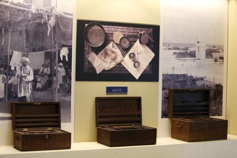 Wooden boxes used by the merchants on display at the Pearl Museum.