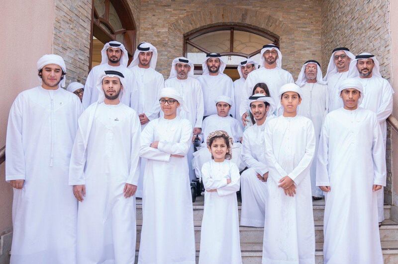 Sheikh Mohamed bin Zayed, Crown Prince of Abu Dhabi and Deputy Supreme Commander of the UAE Armed Forces, takes a photo with Ayesha and the Al Mazrouei family at their home. Courtesy Sheikh Mohamed bin Zayed Twitter