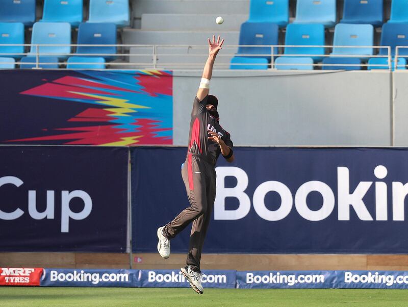 Dubai, United Arab Emirates - October 30, 2019: Rameez Shahzad of the UAE catches George Munsey of Scotland off the bowling of Ahmed Raza during the game between the UAE and Scotland in the World Cup Qualifier in the Dubai international cricket stadium. Wednesday the 30th of October 2019. Sports City, Dubai. Chris Whiteoak / The National