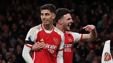 Arsenal's German midfielder #29 Kai Havertz (L) celebrates with Arsenal's English midfielder #41 Declan Rice (R) after scoring their third goal during the English Premier League football match between Arsenal and Chelsea at the Emirates Stadium in London on April 23, 2024.  (Photo by Glyn KIRK / AFP) / RESTRICTED TO EDITORIAL USE.  No use with unauthorized audio, video, data, fixture lists, club/league logos or 'live' services.  Online in-match use limited to 120 images.  An additional 40 images may be used in extra time.  No video emulation.  Social media in-match use limited to 120 images.  An additional 40 images may be used in extra time.  No use in betting publications, games or single club/league/player publications.   /  