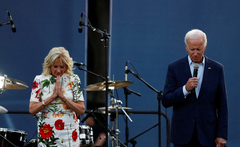 US President Joe Biden and first lady Jill Biden hold a moment of silence for the victims. Reuters