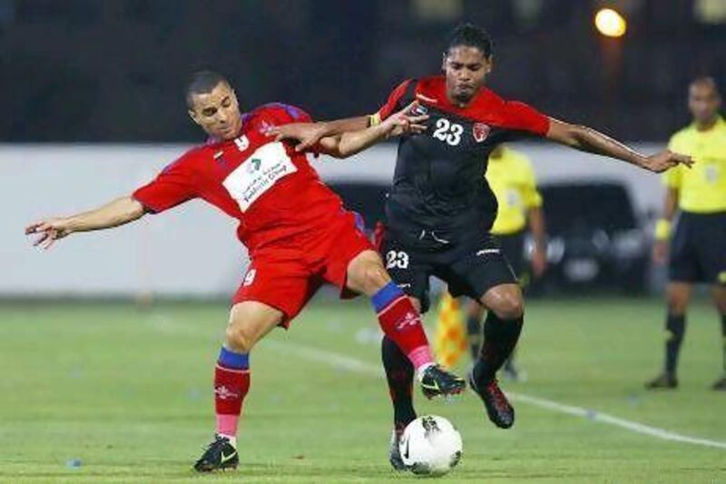 Al Shaab, in red and blue, beat the favourites Emirates in the first-round-robin match.