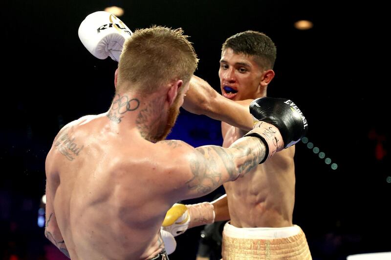 Sebastian Fundora (R) punches Daniel Lewis during their junior middleweight bout at MGM Grand Garden Arena in Las Vegas.  AFP