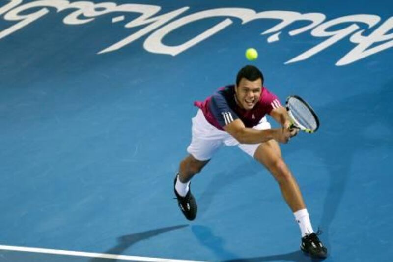 Jo-Wilfried Tsonga from France returns the ball to Robin Soderling from Sweden during the first day of Mubadala World Tennis Championships in Abu Dhabi, United Arab Emirates, Thursday Dec. 30, 2010. (AP Photo/Kamran Jebreili)