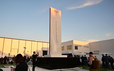 People wait in line for entry to see the unveiling of the new Tesla Model Y beside the Supercharger at the Tesla Design Center in Hawthorne, California on March 14, 2019. Tesla introduced a new electric sports utility vehicle slightly bigger and more expensive than its Model 3, pitched as an electric car for the masses. Tesla chief executive Elon Musk showed off the "Model Y" late Thursday, March 14, 2019, at the company's design studio in the southern California city of Hawthorne, and the company began taking orders online.
 / AFP / Frederic J. BROWN

