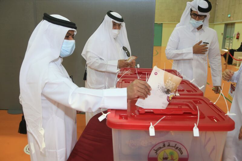 Men vote in legislative elections in Qatar. AP Photo