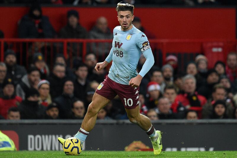 Aston Villa's English midfielder Jack Grealish runs with the ball. AFP