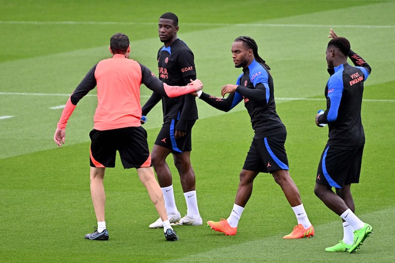 PSG defender Nordi Mukiele, second left, and midfielder Renato Sanches, second right, during training. AFP