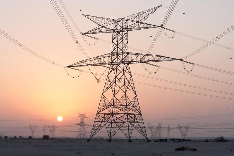 Above, power lines operated by Dubai Electricity and Water Authority. Duncan Chard / Bloomberg