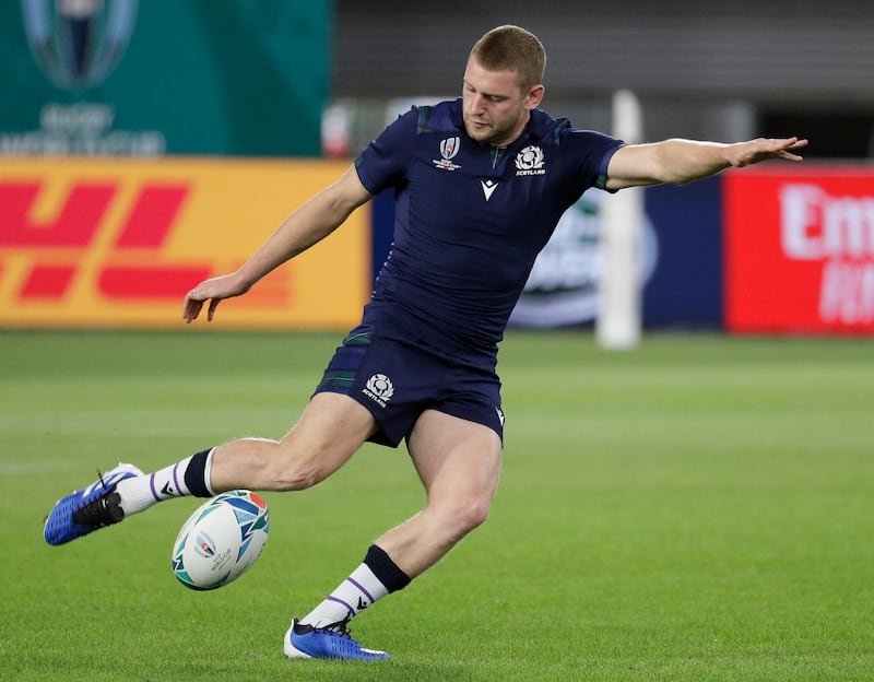 Scotland's rugby player Finn Russell kicks the ball during their training at Kobe Misaki Stadium for the Rugby World Cup in Kobe, Japan. Scotland will play against Samoa tomorrow in their Pool A game. AP Photo