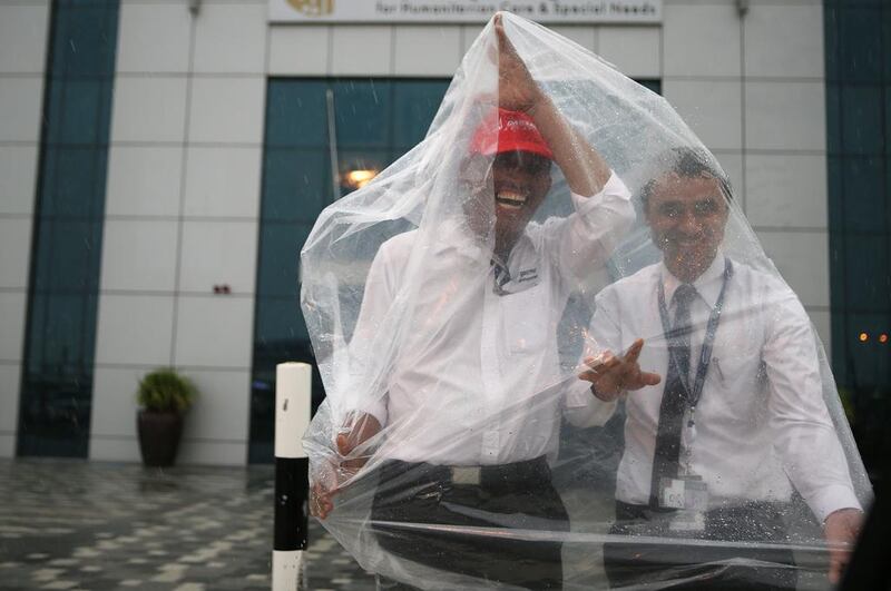 Visitors to Air Expo found their own way to stay dry. Ravindranath K / The National