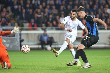 Manchester City's Riyad Mahrez (left) scores their side's fifth goal of the game during the UEFA Champions League, Group A match at the Jan Breydel Stadium, Bruges. Picture date: Tuesday October 19, 2021.