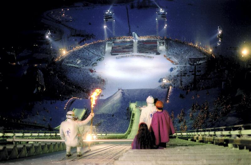 12 FEB 1994:  THE SKI JUMPER PREPARES TO BEGIN HIS DESCENT WITH THE OLYMPIC TORCH DURING THE OPENING CEREMONY AT THE 1994 LILLEHAMMER WINTER OLYMPICS.  Mandatory Credit: Bob Martin/ALLSPORT