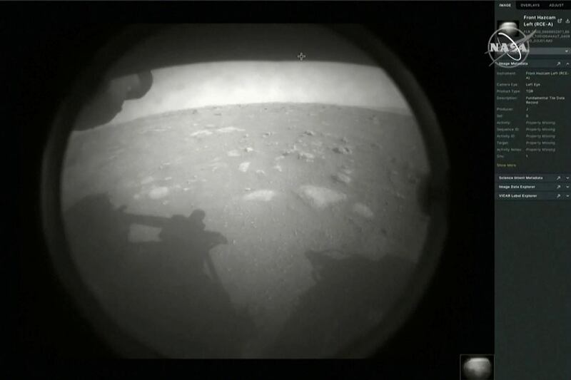 The first images arrive moments after Nasa's Perseverance Mars rover spacecraft successfully touched down on Mars on February 18, 2021. Nasa TV via Reuters