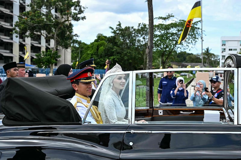 Following the reception, the couple took part in a procession through the streets of Brunei's capital Bandar Seri Begawan. AFP