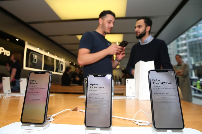 Muhannad Al Nadaf purchases the latest iPhone model at Apple Store in Sydney. Getty Images