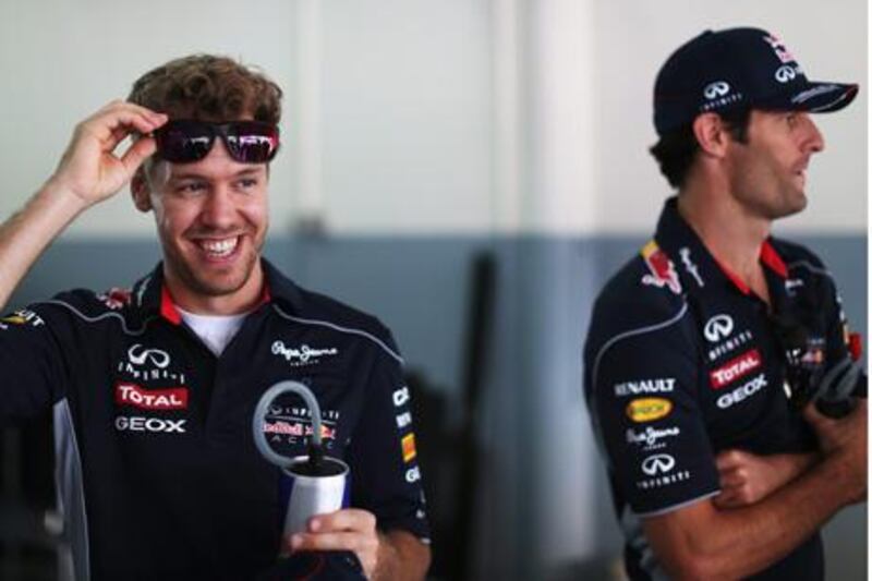 KUALA LUMPUR, MALAYSIA - MARCH 24:  Sebastian Vettel (L) of Germany and Infiniti Red Bull Racing and team mate Mark Webber (R) of Australia and Infiniti Red Bull Racing attend the drivers parade before the Malaysian Formula One Grand Prix at the Sepang Circuit on March 24, 2013 in Kuala Lumpur, Malaysia.  (Photo by Mark Thompson/Getty Images)