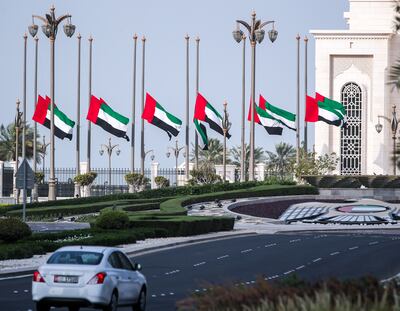 UAE flags at Qasr Al Watan at half-mast on Thursday morning to mark the death of Sheikh Saeed bin Zayed. Victor Besa / The National