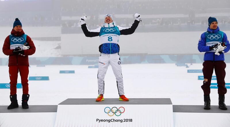 Gold medallist Iivo Niskanen of Finland reacts during the medals ceremony at the Winter Olympics. Kai Pfaffenbach / Reuters