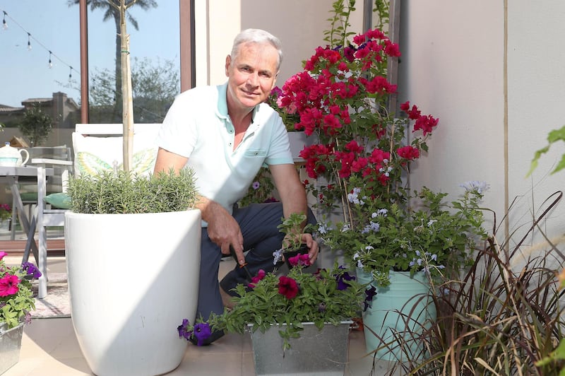 DUBAI , UNITED ARAB EMIRATES , December 19 – 2020 :- Michael O'Riordan painted the upcycled furniture and placed in the garden of his villa in Al Reem, Mira 4 in Dubai. He bought some furniture items from junk shop and some from his friends and repainted and placed outside his villa and in the garden. ( Pawan Singh / The National ) For Lifestyle/Online/Instagram.