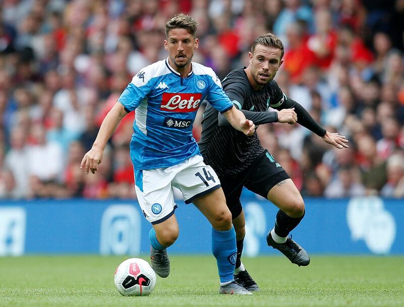 Napoli's Dries Mertens in action with Liverpool's Jordan Henderson. Reuters