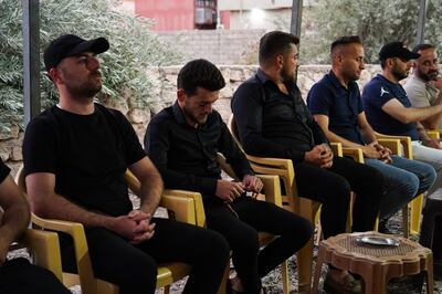Steven Nabil, second from left, fiance of Maryam Moatasem, who died in the wedding hall fire, attends her funeral in Qaraqosh, northern Iraq. Ismael Adnan for The National