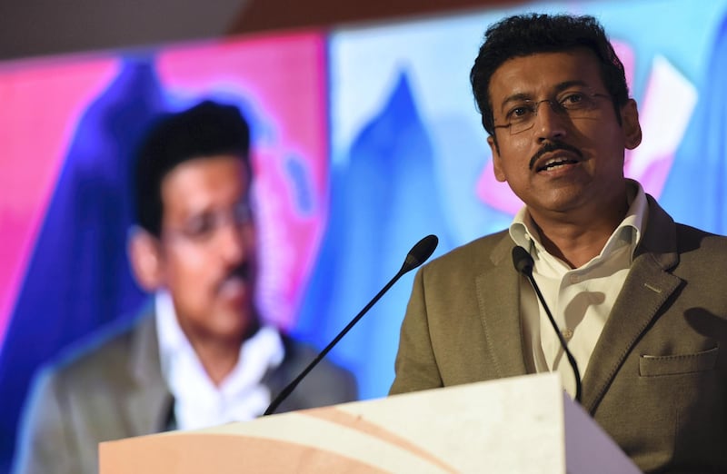 Rajyavardhan Singh Rathore, Indian Minister of Youth Affairs and Sports, speaks during a sponsorship event in New Delhi on February 26, 2018. 
The Indian Olympic Association announced a partnership with the financial services Edelweiss Group for the 2018 Commonwealth Games, 2018 Asian Games and 2020 Olympic Games. / AFP PHOTO / MONEY SHARMA