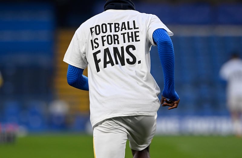 Brighton players wearing t-shirts reading 'Football is for the fans' in protest against the proposed European Super League, ahead of their match against Chelsea at Stamford Bridge on Tuesday, April 20. EPA
