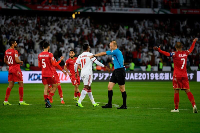 Jordanian referee Adham Makhadmeh calls for a penalty. AFP